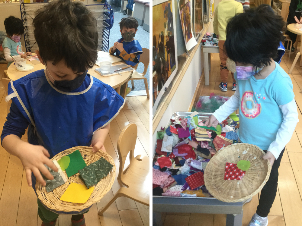 On the left, a child holds out a flat basket with several pieces of green and yellow fabric scraps, on the right a child adds fabric scraps to a flat basket from a large tray of fabric 